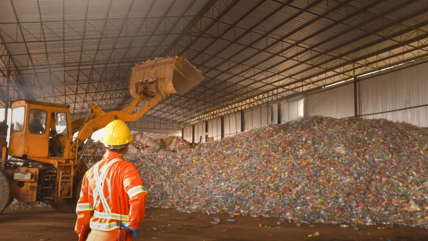 Plastic recycling plant material stream prepared for plastic shredder feeding