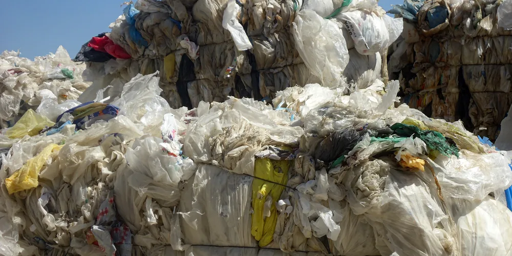Plastic film and woven bag waste for recycling shredder applications