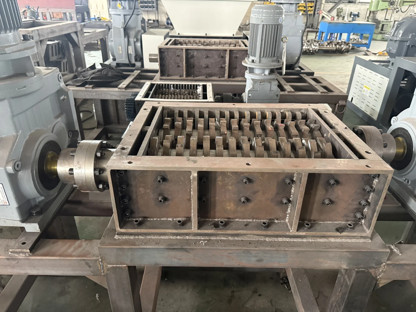 Twin-shaft shredder chamber, cutters and frame during workshop assembly