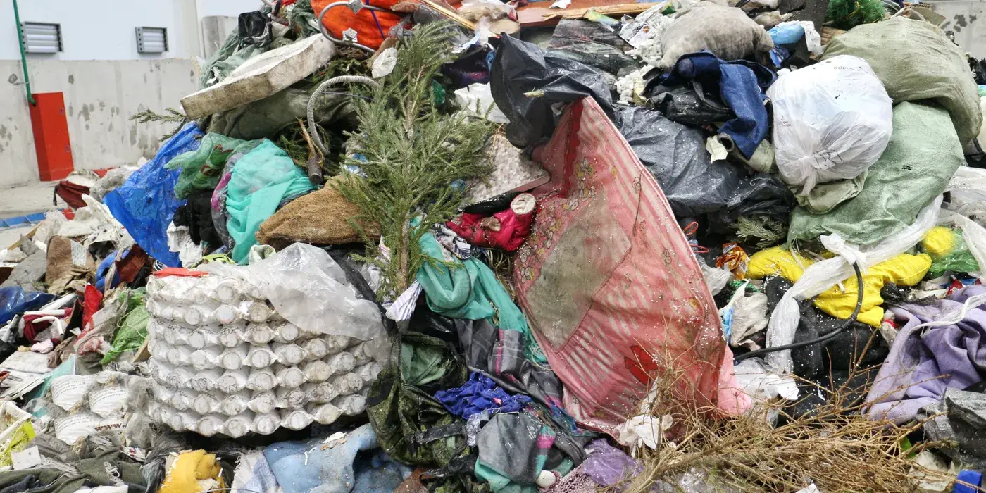 Municipal solid waste prepared for solid waste shredder volume reduction