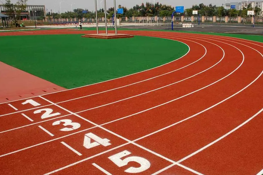 Recycled tire rubber material used for sports surface applications